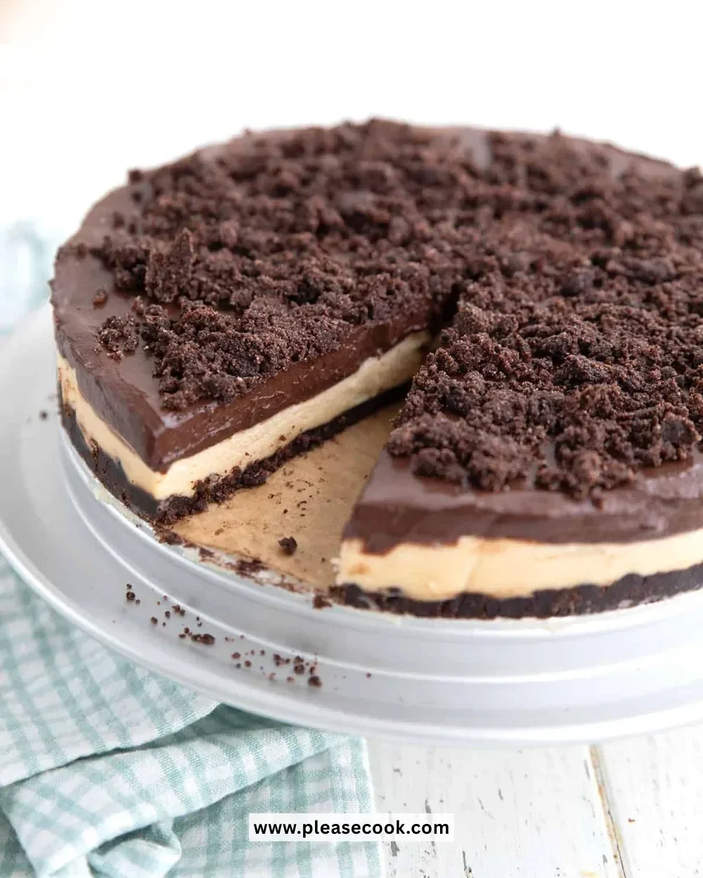 Slice of Keto Peanut Butter Dirt Cake topped with chocolate and nuts.