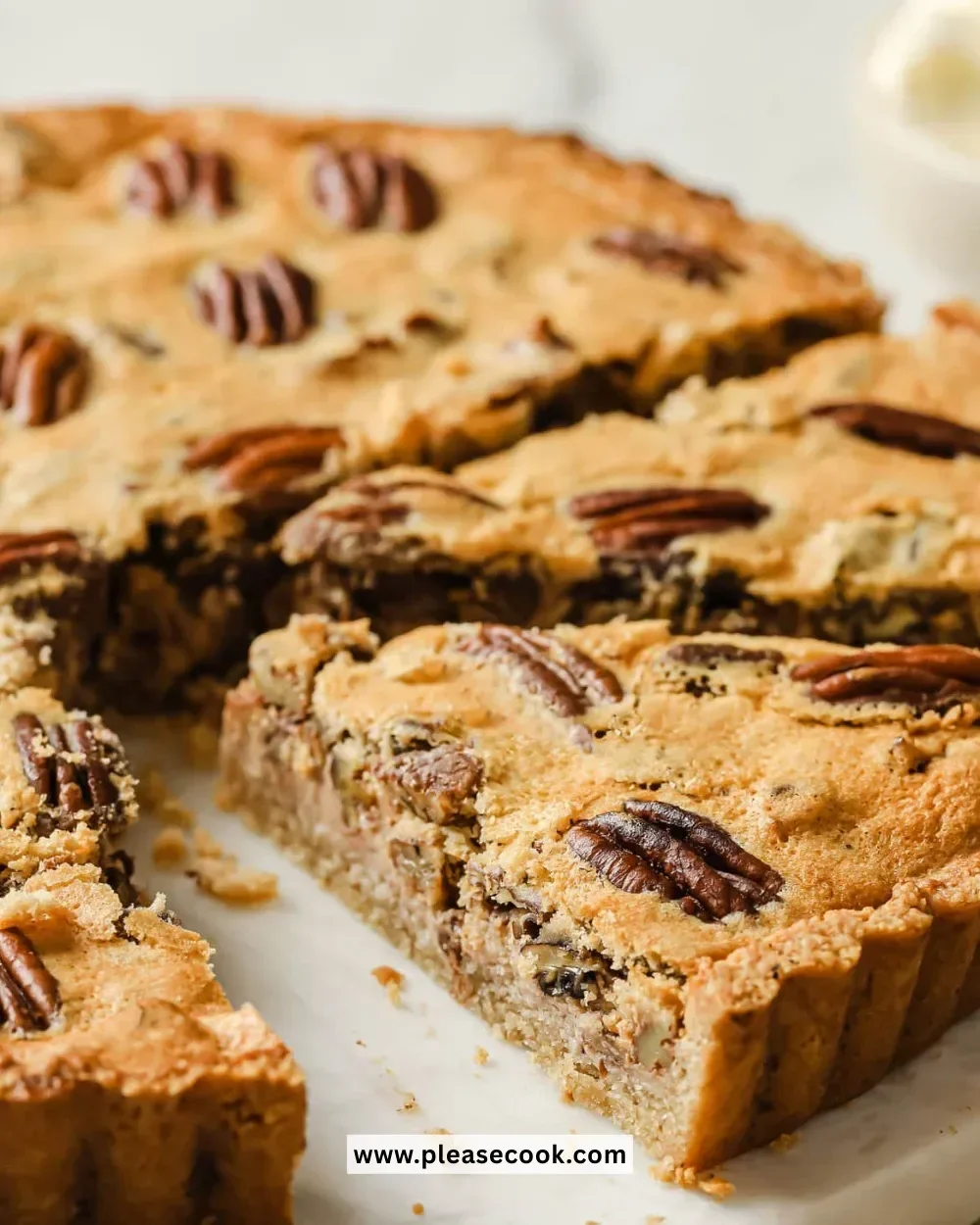 Delicious Keto Pecan Pie served on a plate with whipped cream.