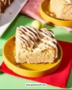 Lazy Morning Eggnog Coffee Cake topped with icing and spices on a platter