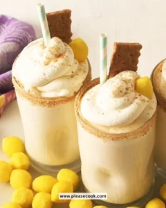 Creamy lemon pie milkshake topped with whipped cream and lemon zest