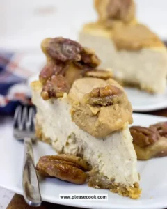 Delicious Maple Pecan Praline Cheesecake topped with pecans and praline sauce
