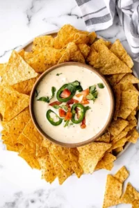 Delicious Mexican cheese dip served with tortilla chips