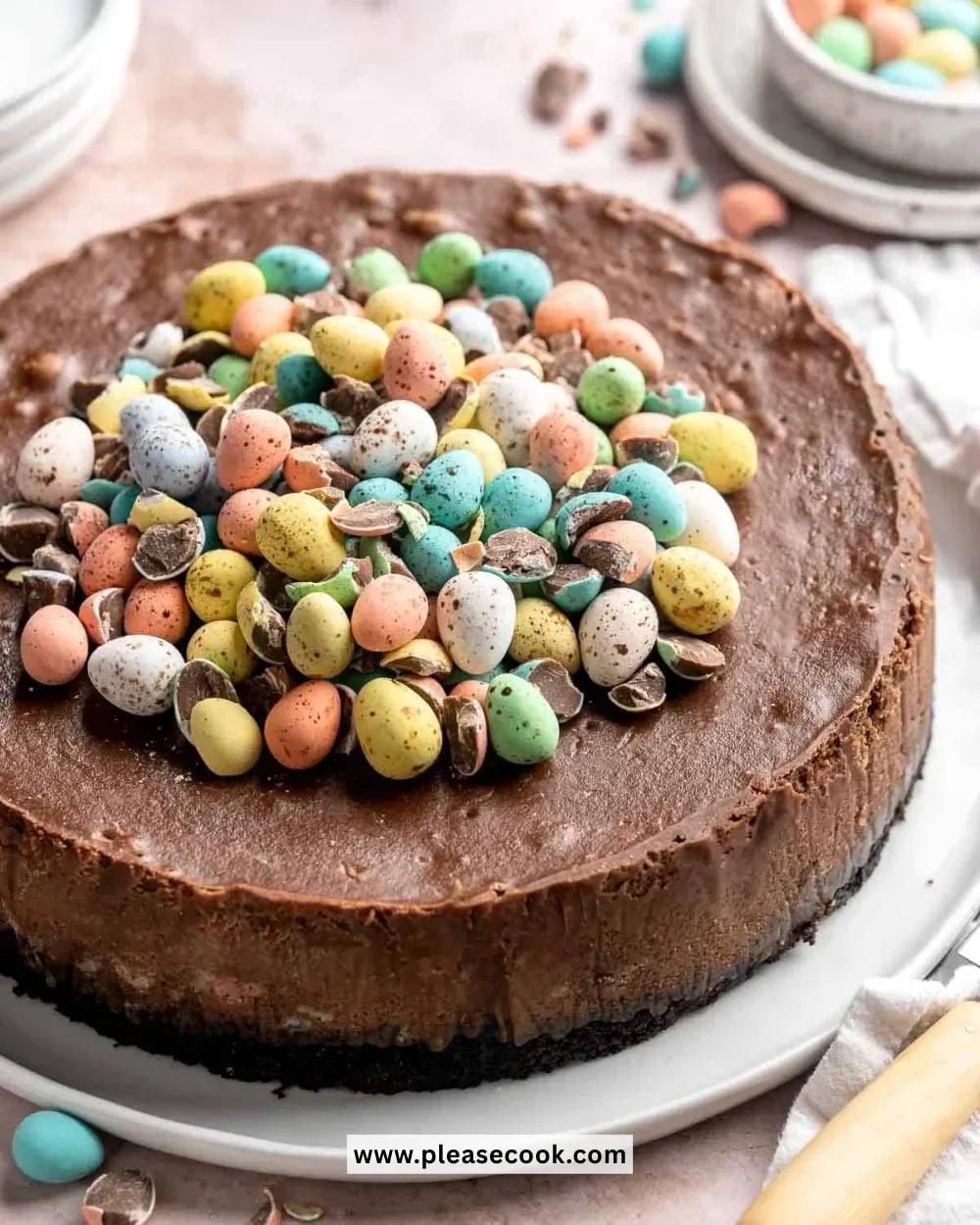 Delicious Mini Egg Easter Cheesecake topped with chocolate mini eggs.