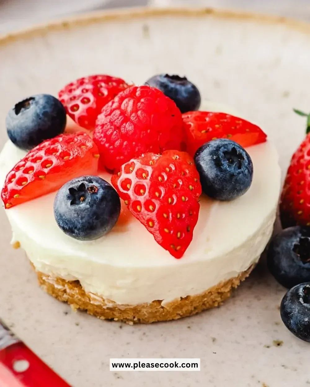 Delicious no bake mini cheesecakes topped with berries on a serving platter.