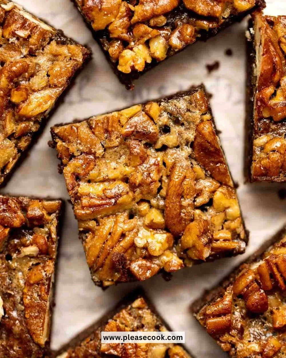 Decadent pecan pie brownies topped with pecans and chocolate drizzle
