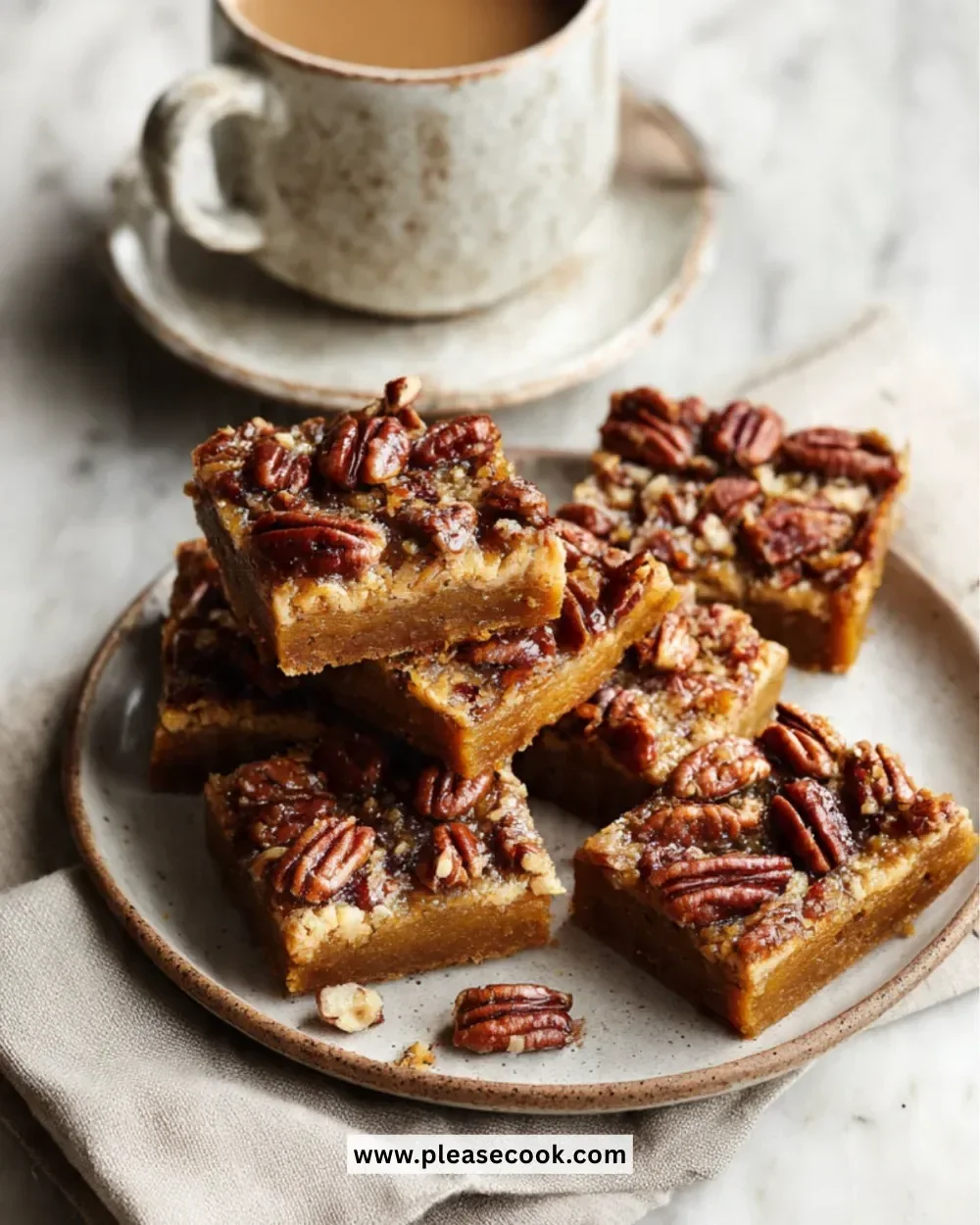 Deliciously baked Pumpkin Pecan Bars topped with pecans and spices