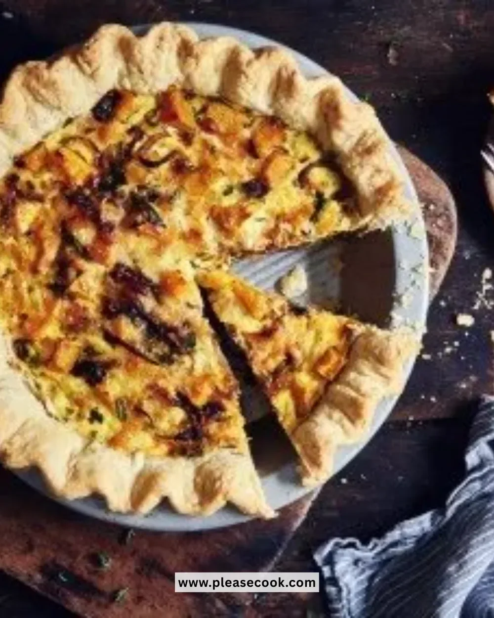 Delicious roasted butternut squash and spinach quiche served on a plate