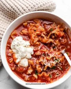 Bowl of slow cooker lasagna soup topped with cheese and herbs