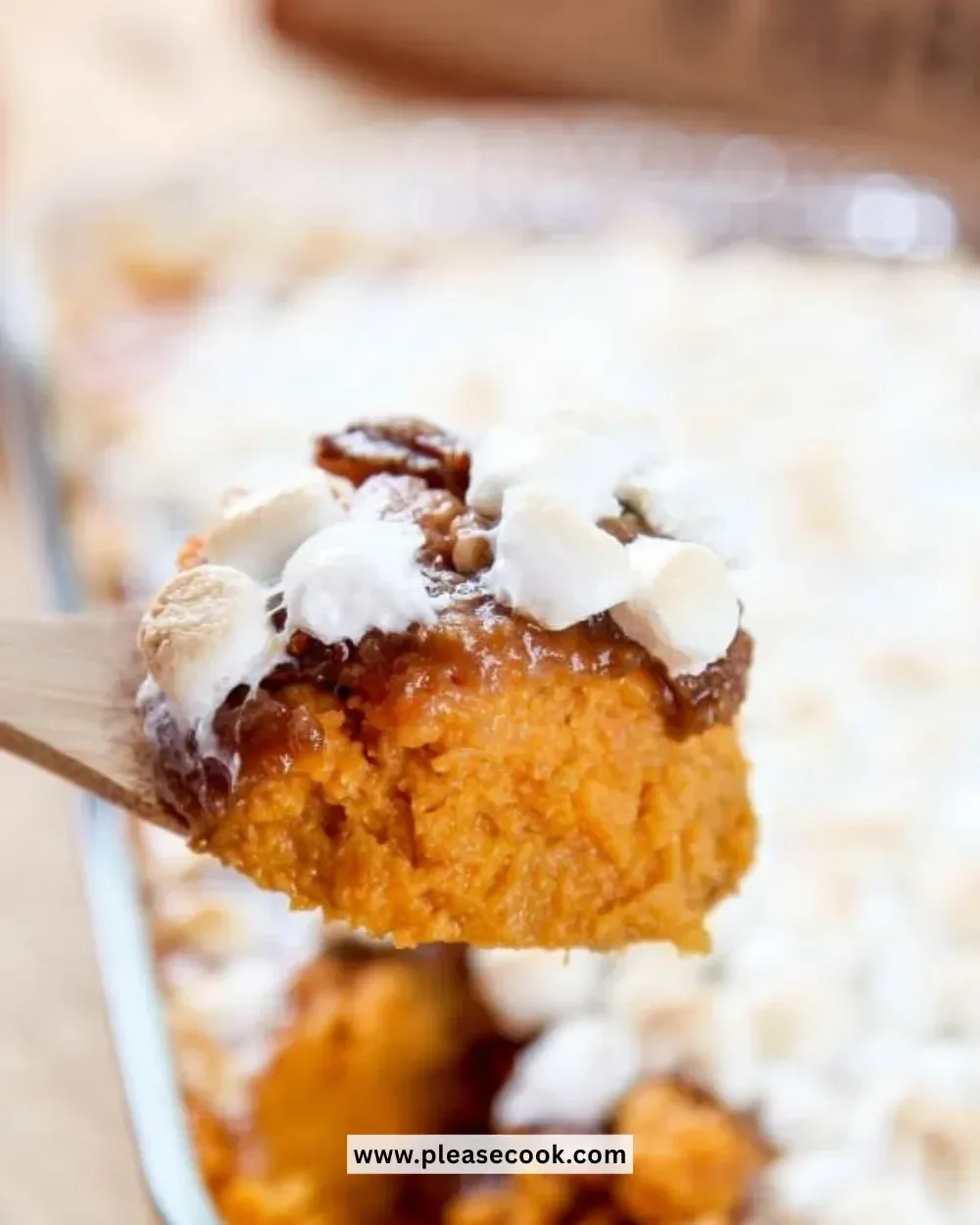 Delicious slow cooker sweet potato casserole garnished with marshmallows and nuts