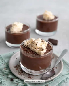 Delicious sugar free chocolate pudding in a bowl garnished with cocoa powder and mint.