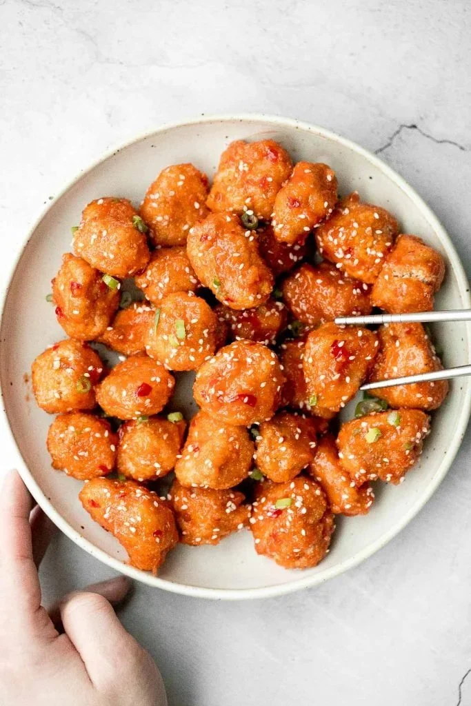 Plate of sweet chili chicken bites served with dipping sauce