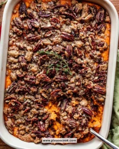 Delicious sweet potato casserole topped with marshmallows and pecans