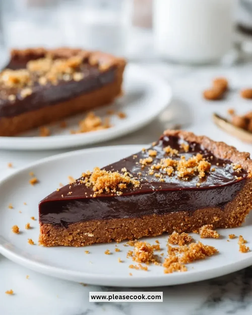 Vegan gingerbread chocolate tart sliced on a plate