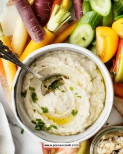 Delicious white bean dip served with fresh vegetables and pita bread