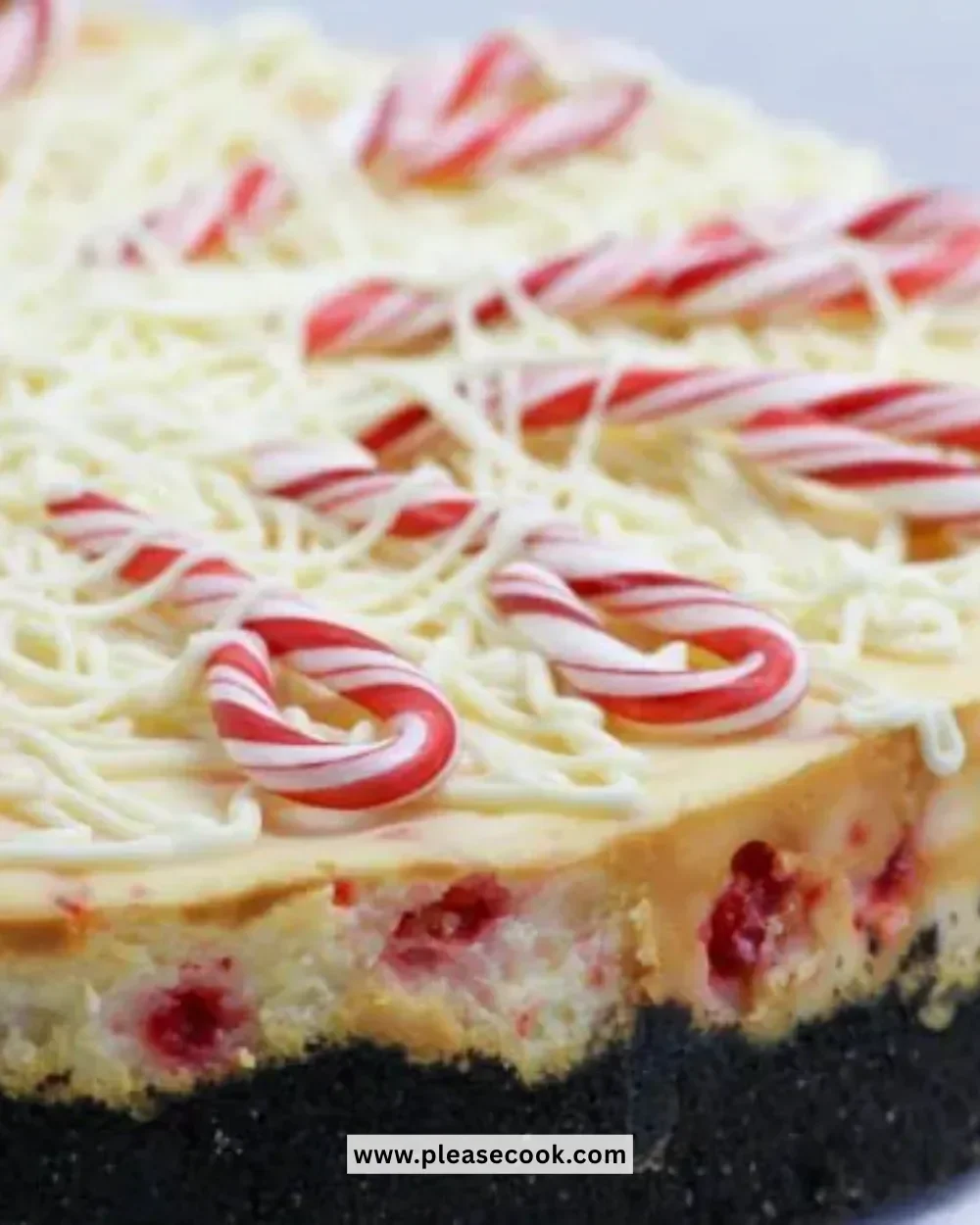 Slice of white chocolate peppermint cheesecake on a plate with festive decorations