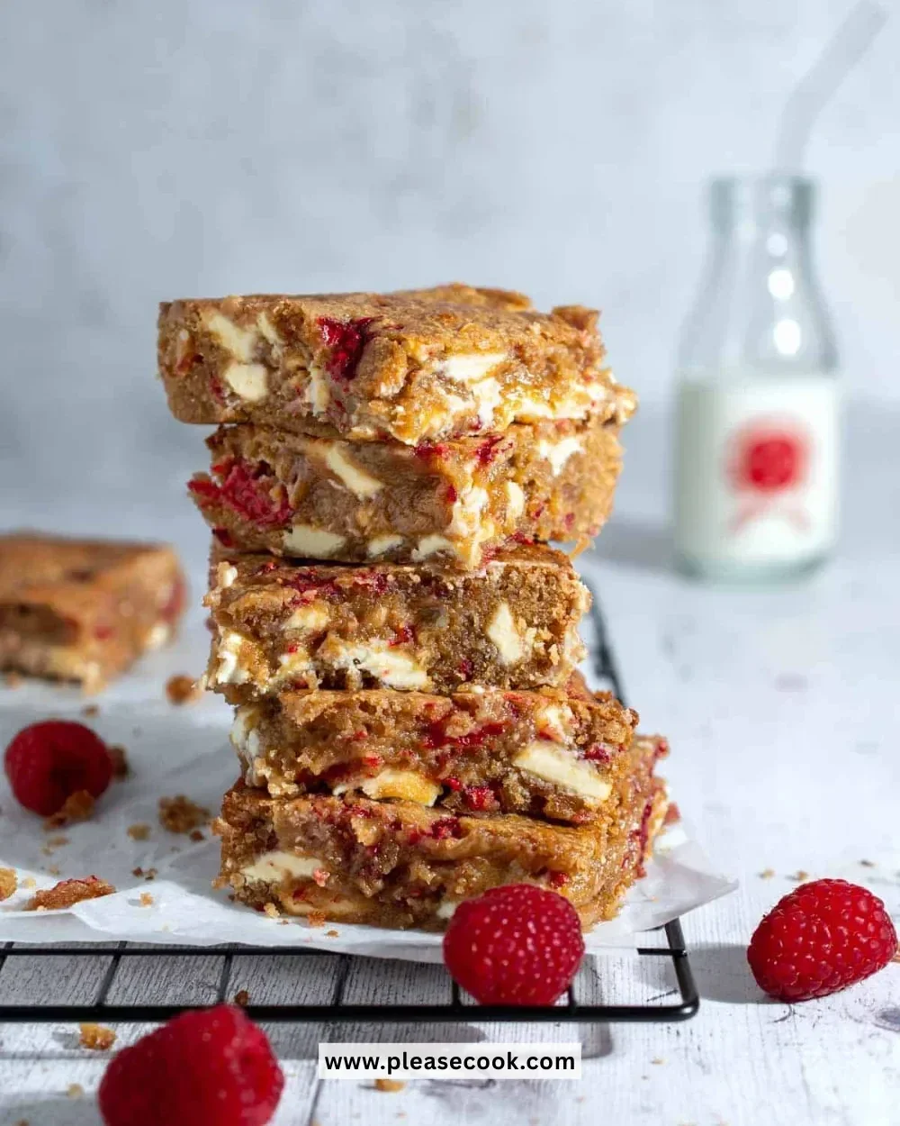 Delicious white chocolate raspberry blondies on a plate