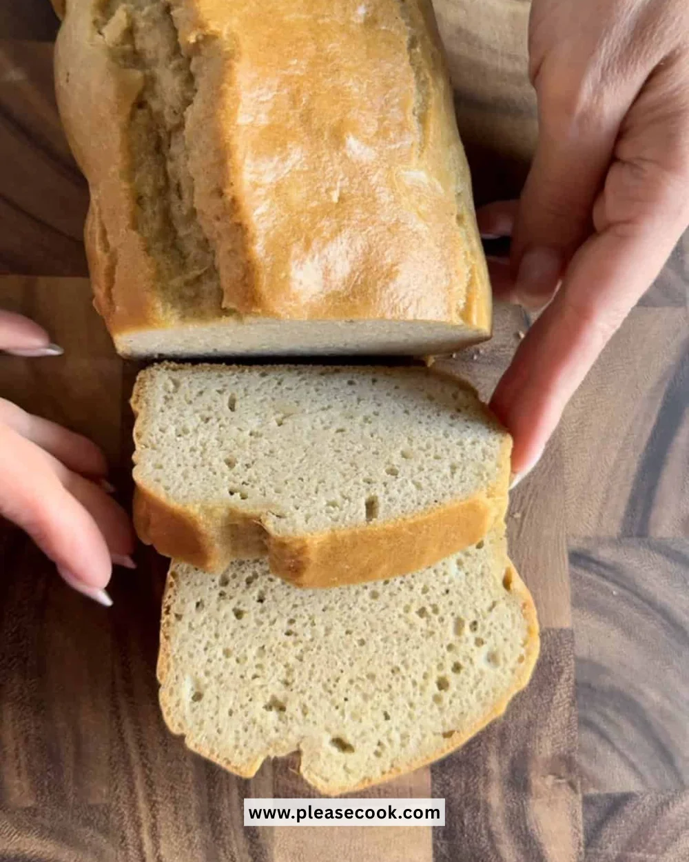 Loaf of freshly baked almond flour bread on a wooden cutting board