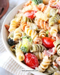 Bacon Ranch Pasta Salad garnished with fresh herbs and crispy bacon
