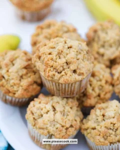 Freshly baked banana crumb muffins with a golden brown topping