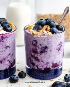 Delicious bowl of blueberry overnight oats topped with fresh blueberries and almonds