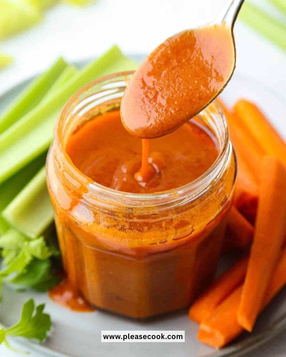 Delicious Buffalo Sauce in a bowl, perfect for chicken wings and dipping.