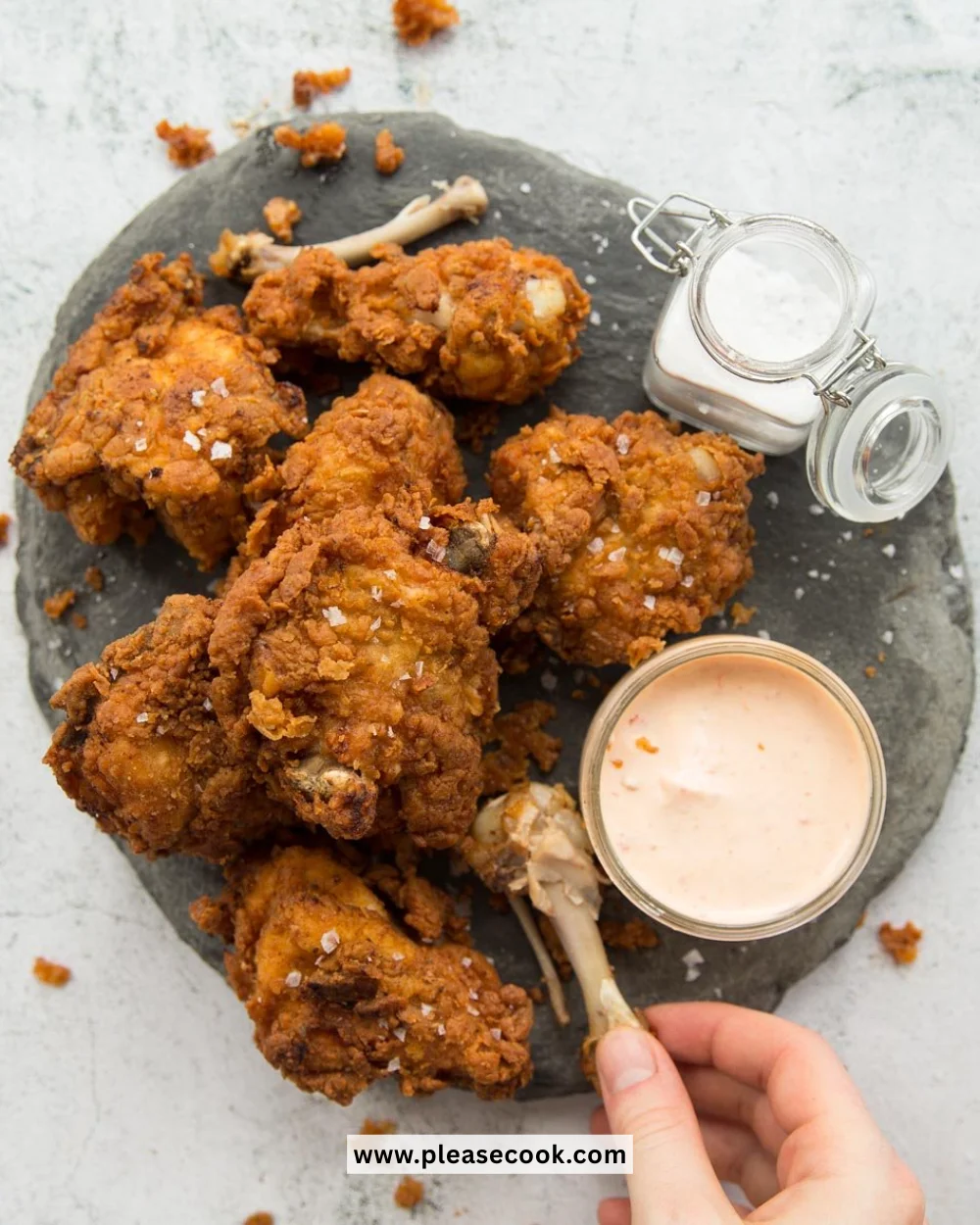 Plate of crispy buttermilk fried chicken served with sides