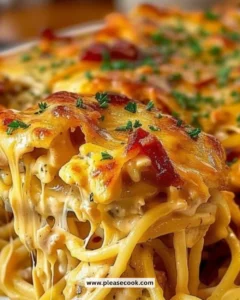 Creamy Cheesy Chicken Spaghetti served in a bowl with cheese and herbs