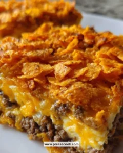 Cheesy taco casserole served in a baking dish with toppings