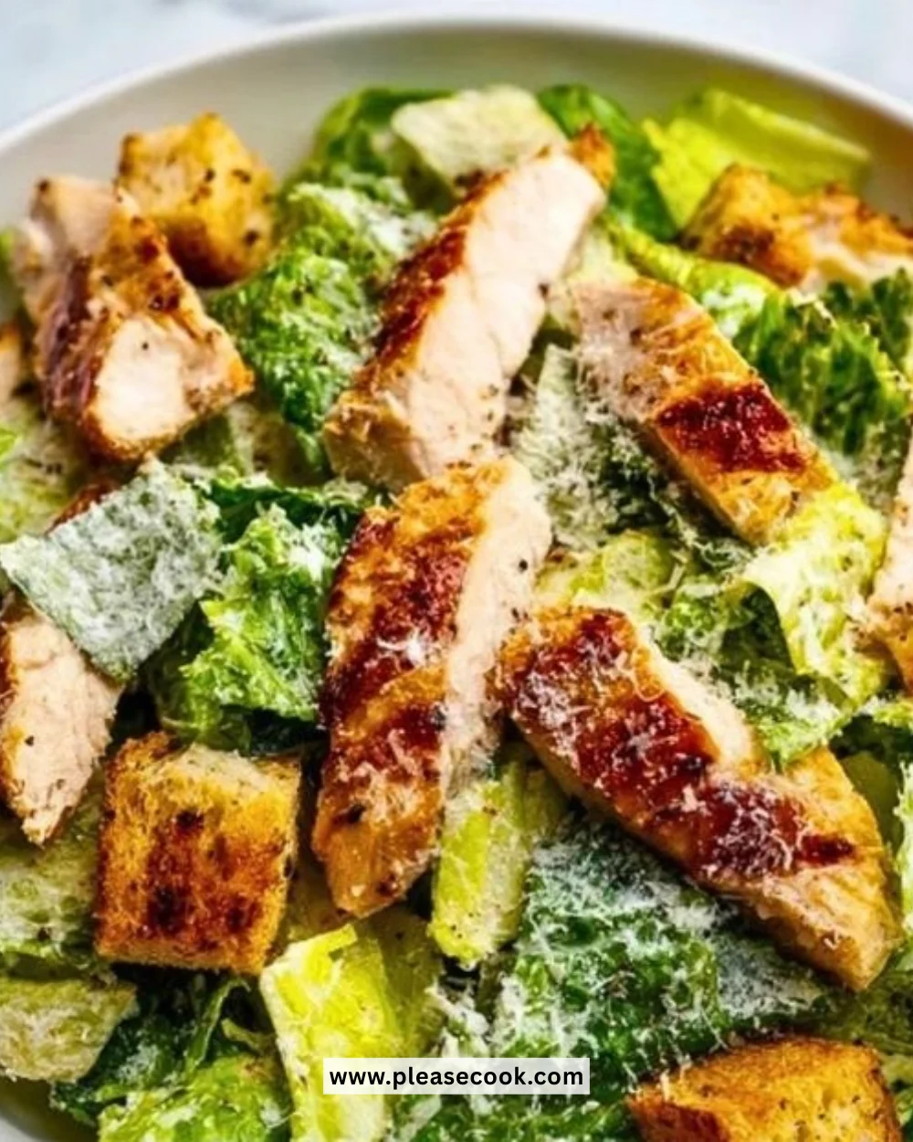 Classic Chicken Caesar Salad with grilled chicken, romaine, and Caesar dressing