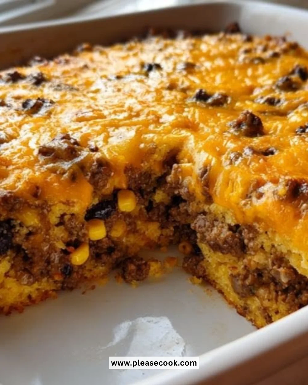 Cowboy Cornbread Casserole served in a baking dish with toppings