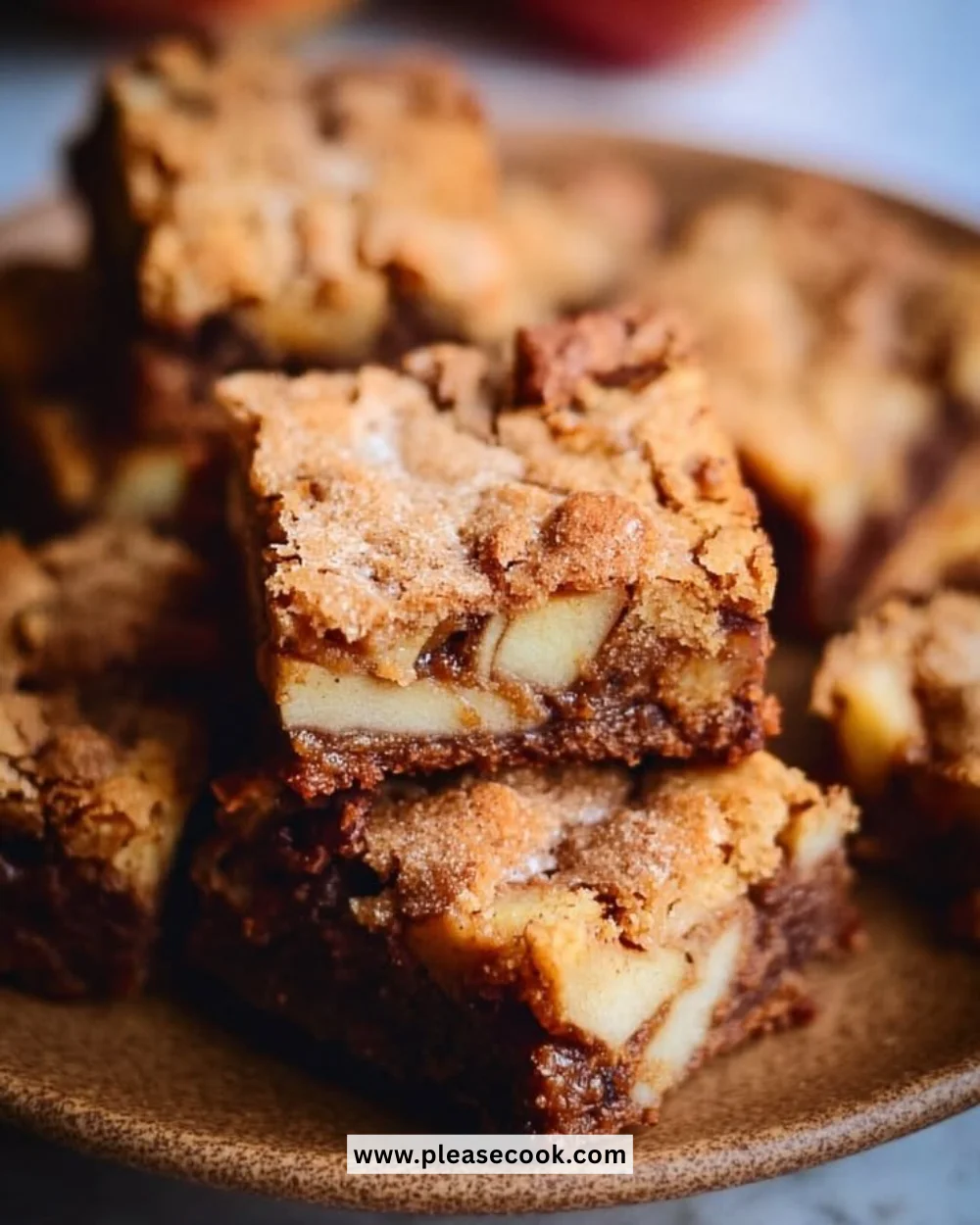 Deliciously baked cozy apple brownies with chunks of fresh apple.