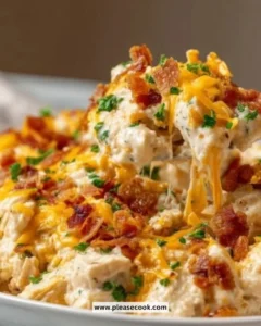 Delicious Crack Chicken Casserole topped with cheese and herbs