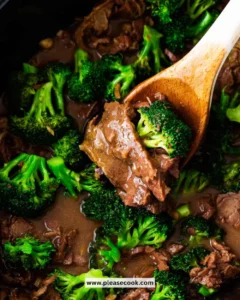 Crockpot Beef and Broccoli dish served with rice on a plate