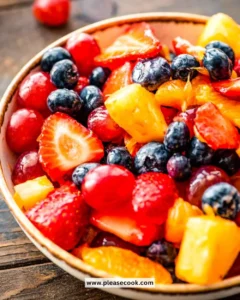 Colorful and fresh easy fruit salad in a bowl with various fruits