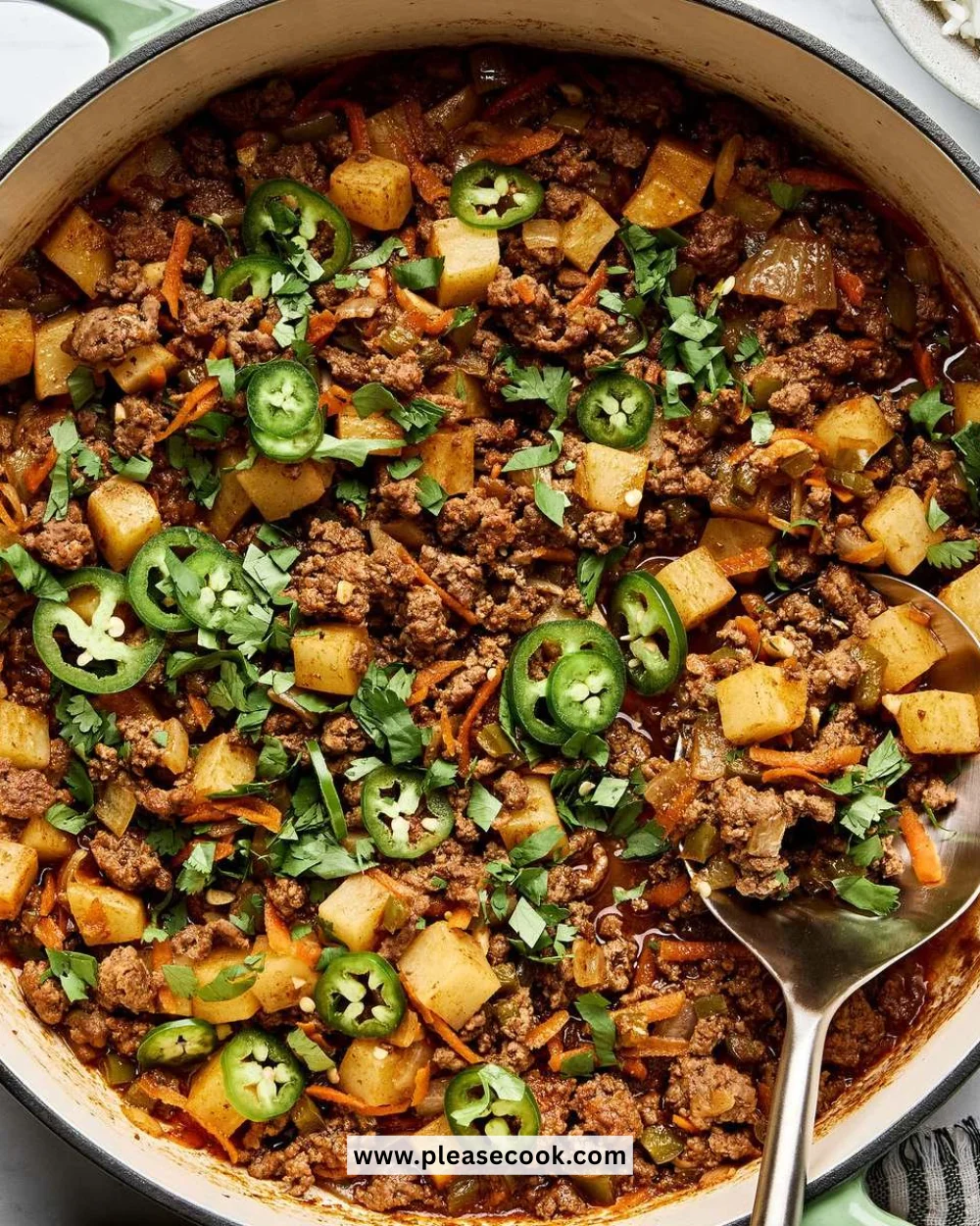 Delicious plate of homemade picadillo served with rice and plantains.