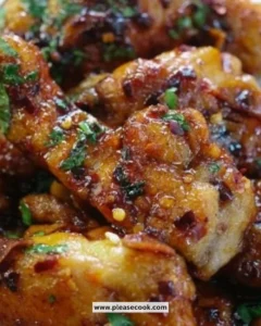 Easy soy garlic chicken thighs on a plate garnished with green onions