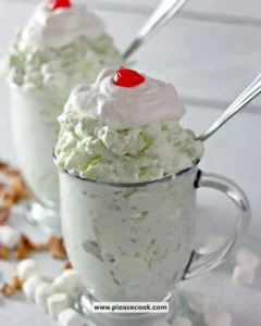 Bowl of Easy Watergate Salad with whipped topping, marshmallows, and nuts.