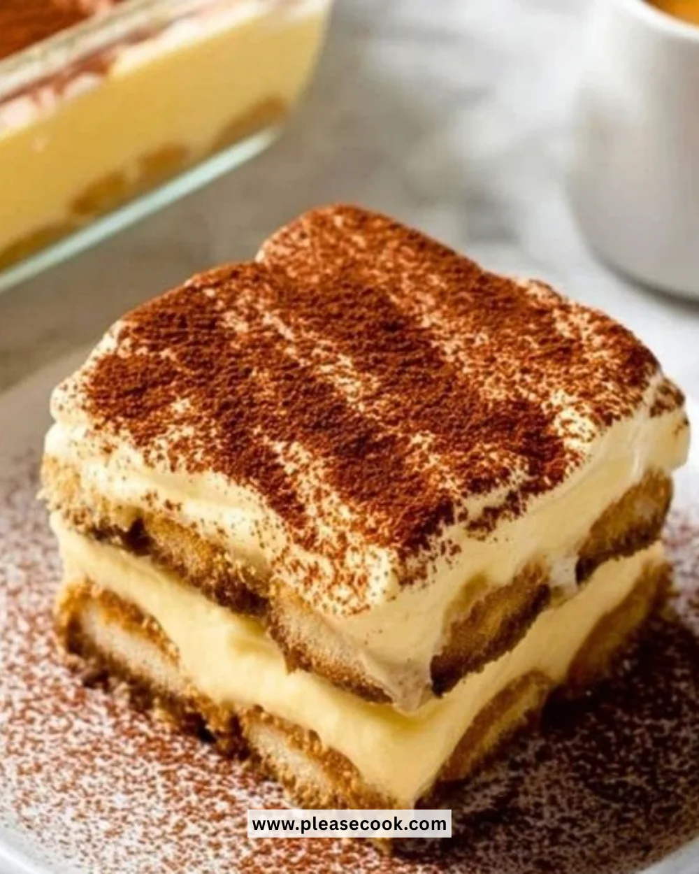 Delicious Eggnog Tiramisu dessert topped with festive spices and whipped cream