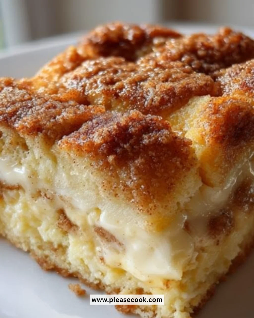 Delicious French Toast Casserole topped with syrup and berries