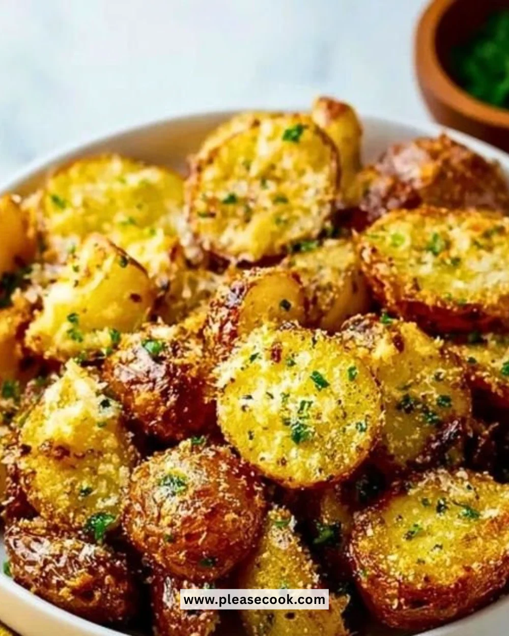 Delicious garlic parmesan roasted potatoes served on a plate.