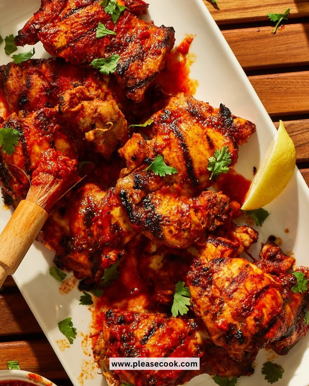 Succulent Harissa Grilled Chicken marinated in spicy seasoning, ready to be served.