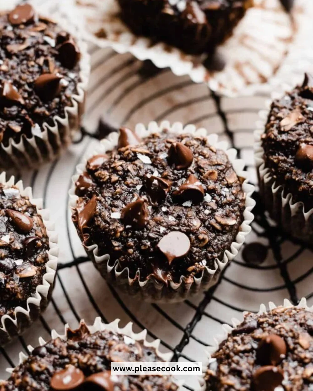 Delicious healthy chocolate muffins on a rustic wooden table