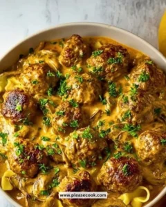 A plate of homemade meatball stroganoff with creamy sauce and pasta.