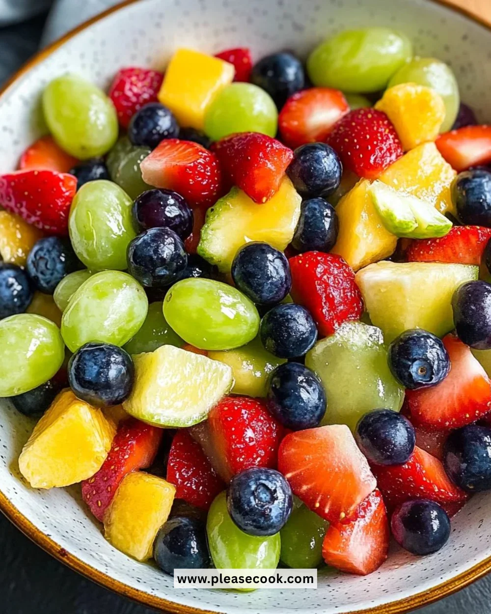 Colorful honey lime fruit salad with a mix of fresh fruits