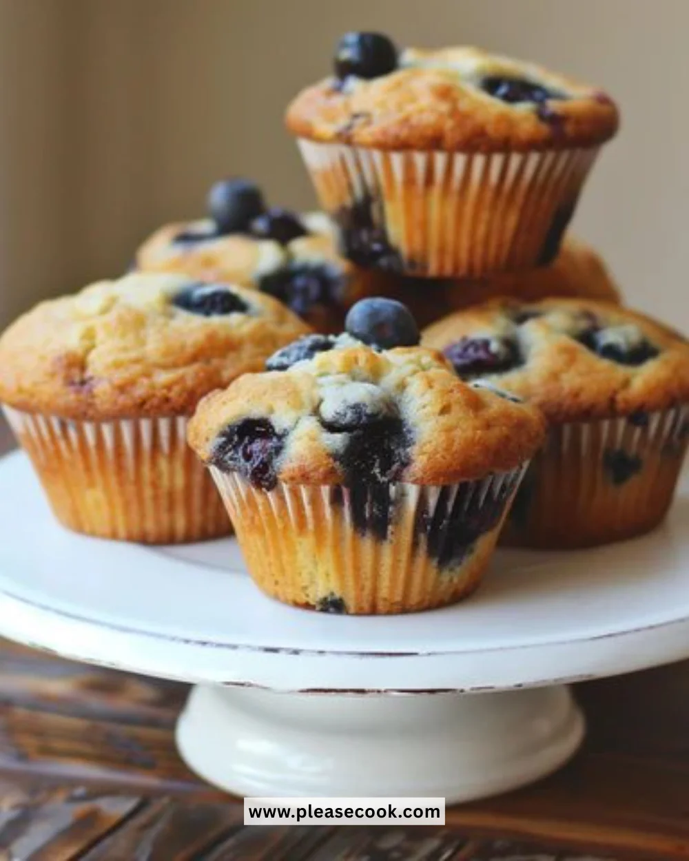 Freshly baked Keto Blueberry Muffins on a wooden table
