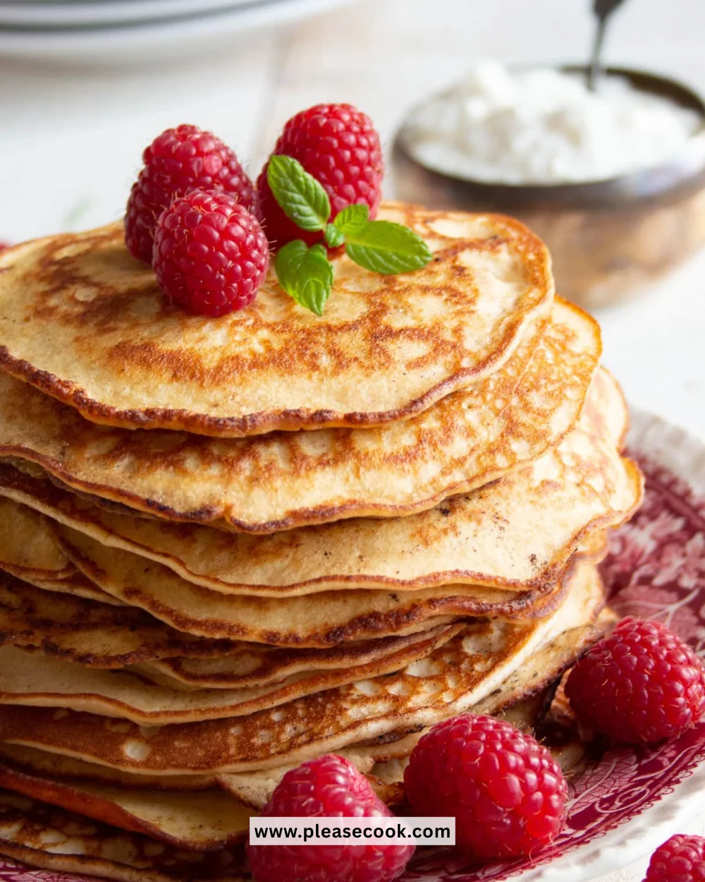 Fluffy Keto cream cheese pancakes with syrup on a plate