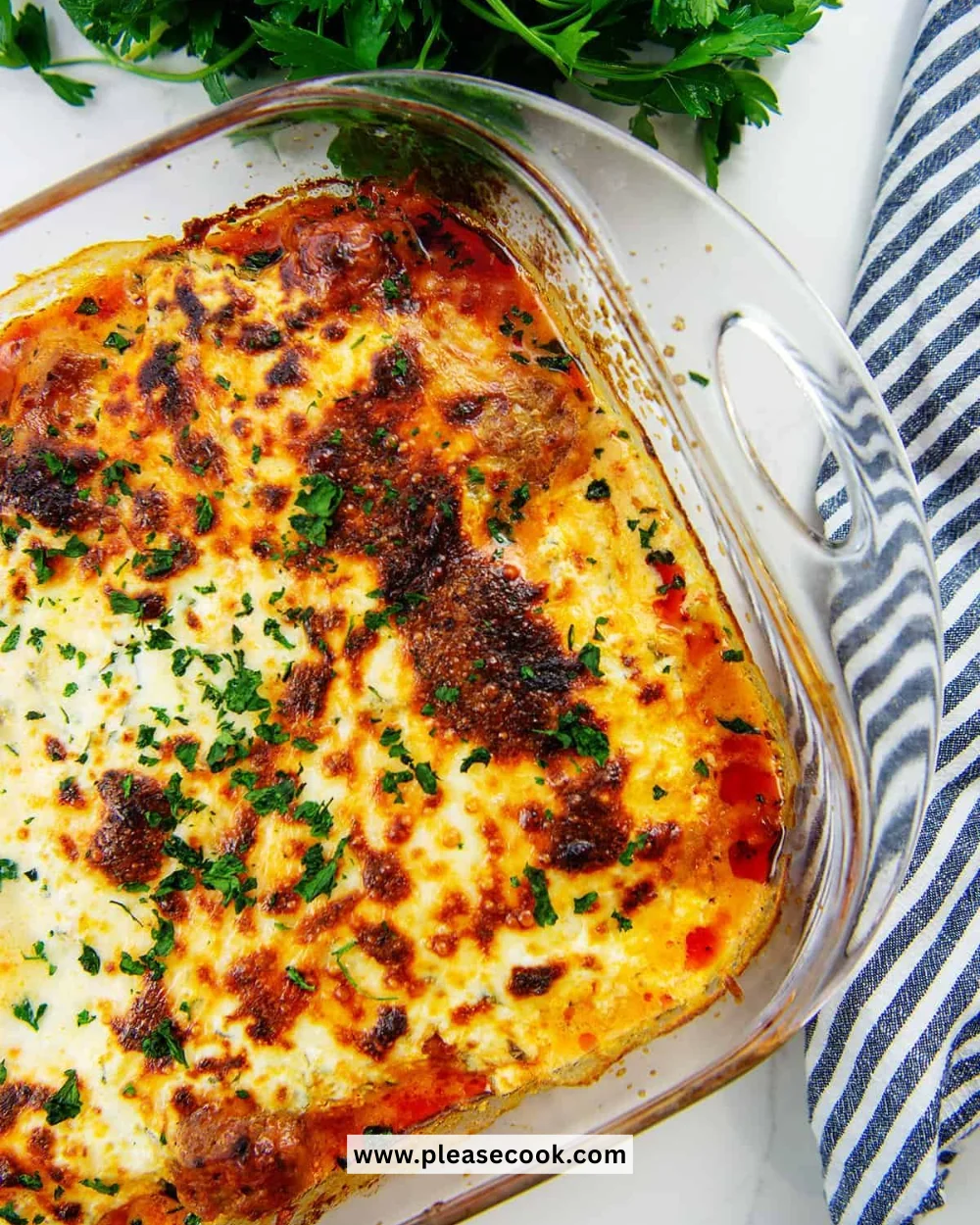 Keto Meatball Casserole with cheese and herbs served in a baking dish