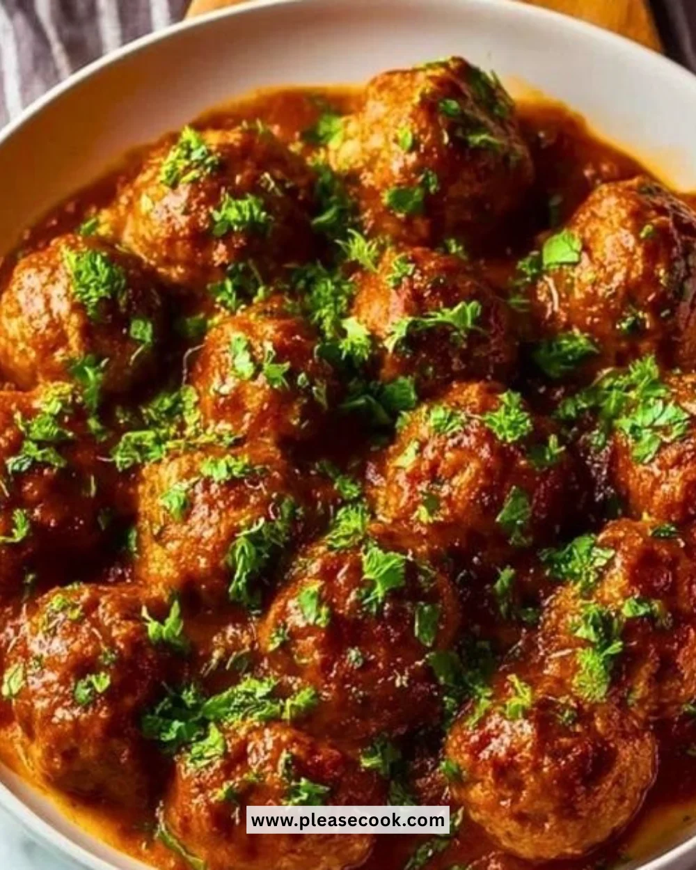 Delicious Marry Me Meatballs served with spaghetti and garnished with parsley