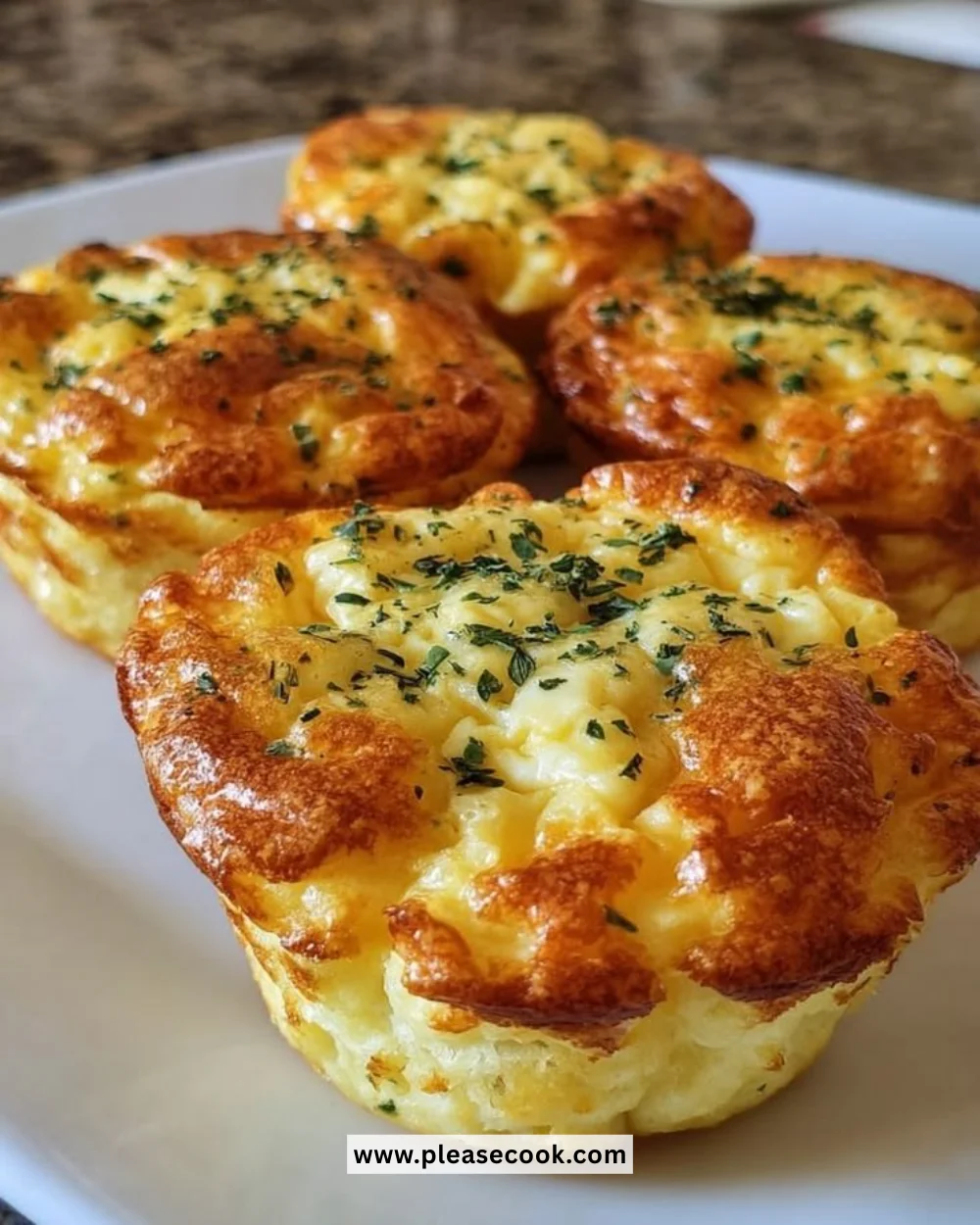 Delicious Million Dollar Twice-Baked Potatoes topped with cheese and herbs.