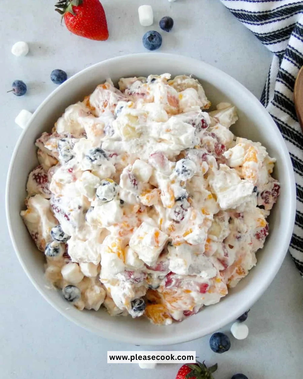 Delicious Mom's Creamy New York Fruit Salad with a variety of fresh fruits and creamy dressing.